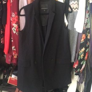 Long sleeveless coat/ jacket or even short dress
